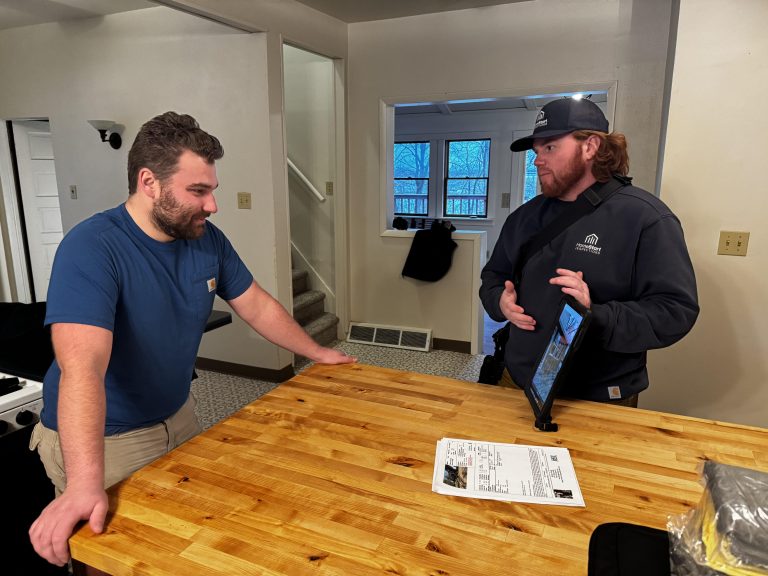 HomeStart inspector going over inspection findings with a homebuyer