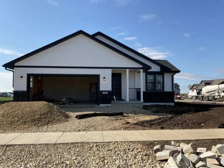 Newly built two-story home with an unfinished yard in Cross Plains, WI, ready for inspection