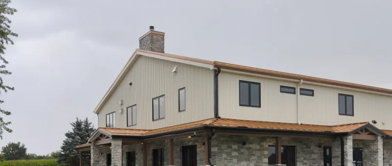 Two-story barndominium with steel siding, metal roof and stone-wrapped porch near Milton, WI