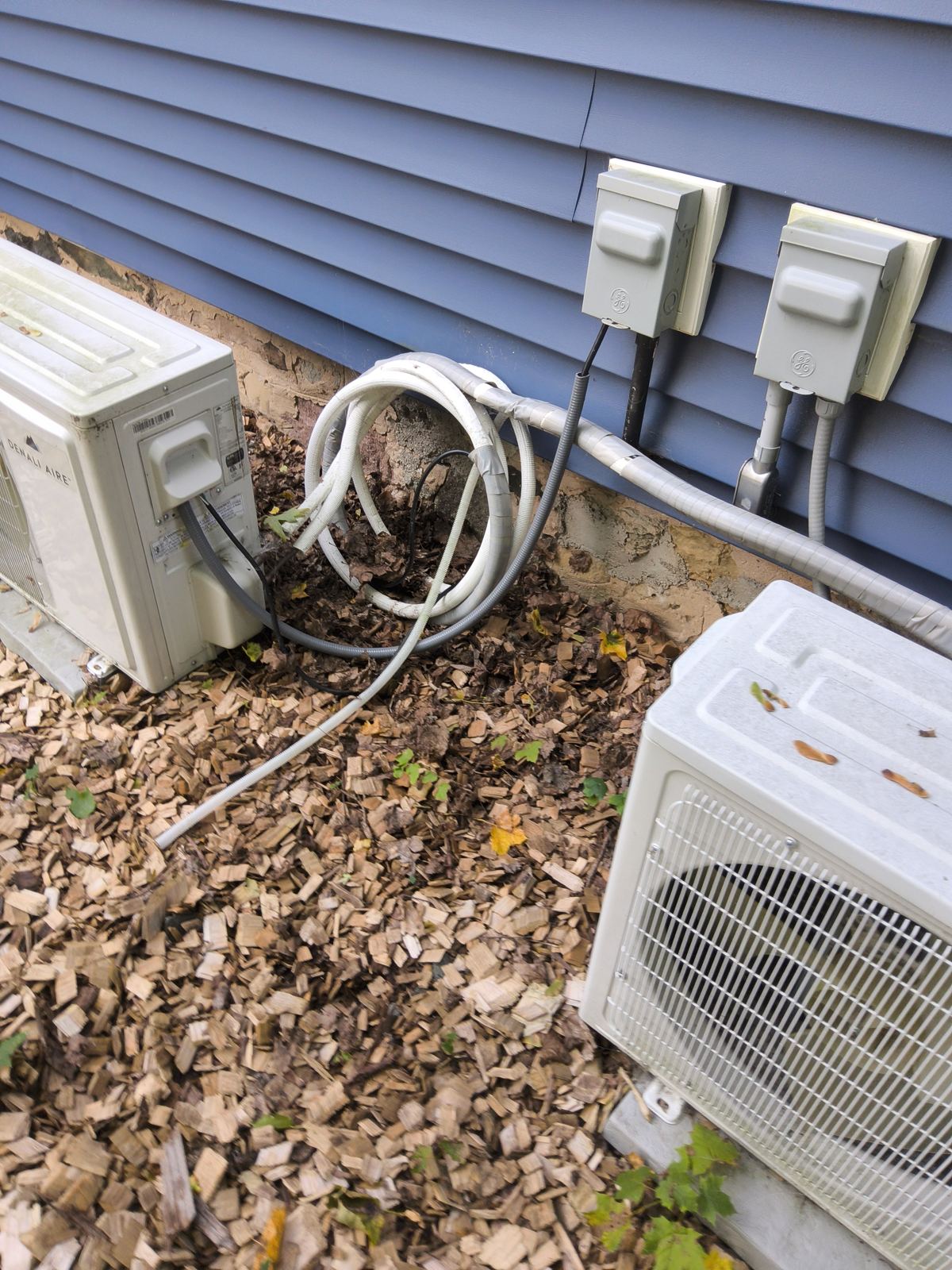 Exterior mini-split heat pump units and line sets checked during a Madison-area home inspection